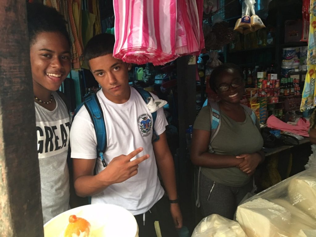 Robert, Jeremy and Ny'Rayah selling rice and beans