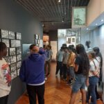 students viewing an exhibit in the Museo del Canal